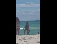 Woman dances in black swimsuit 