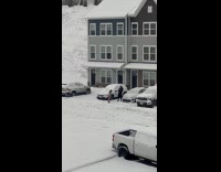 Woman in bikini poses outside the snow