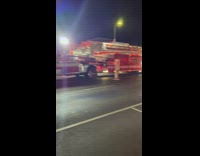 Two guys dance fire fighters on street