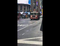 Guy tries to throw coffee at passing firetruck