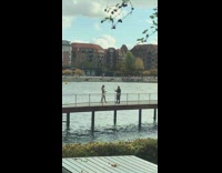 Woman onesie swimsuit walk on bridge bay