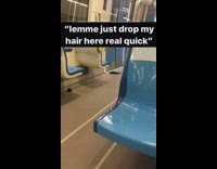 Black hair extensions on subway by door 