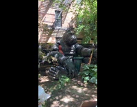 Huge King Kong statue with Spiderman on yard