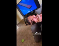 Baby in crib covers face and eyes to crying baby