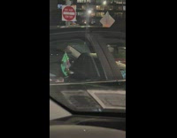 Man with light up Jason mask in car