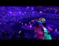 Woman walks on stadium seat aisle falls