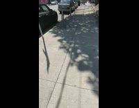 Blue dress girl pink building wall sidewalk