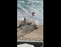 Woman red swimsuit lifebuoy baywatch run beach