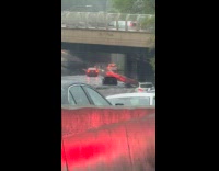 Collab WINY - Highway road under bridge is flooded during storm