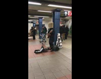 Man With Basket on Head Plays Guitar and Sings on Subway