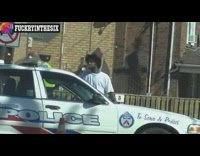 NSFW guy in white shirt talking to cop pretending to day drink