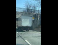 Truck stuck under bridge underpass gets honked