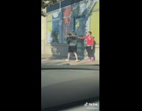 Man Picks Up Dog That Won't Leave Girl Alone