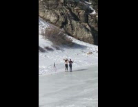 Two girls body shake snow mountain tripod