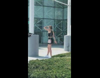 Girl black top printed bag block sunlight