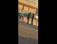 Girl tube top hold jacket over ledge 