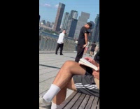 Collab WINY - Man black shirt short cap spread arms dance spin domino park