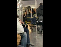 Guy brings furniture and chair on subway 