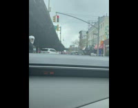 Woman crosses street in face shield 