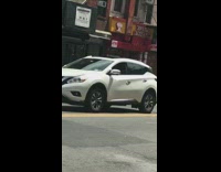 Guy in purple shirt dances on the street with piano music in background