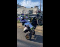 Buzz Lightyear mascot do wheelie with ATV