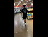 Guy picks up cart in grocery store