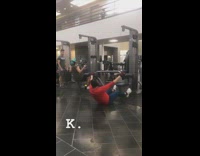 Guy uses exercise pulldown machine wrong gym