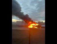 Car on bridge is on fire 