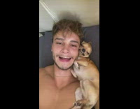 Guy and dog do lip smiles 