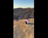 Couple kiss video on valley at sunset