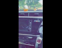 Shirtless guy white shorts headstand concrete block 