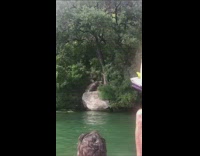 guy black shorts rope swing lands on back