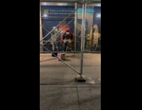 Collab winy - Muscled clown man exercise on sidewalk scaffolding