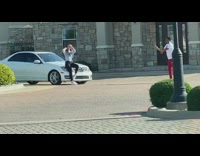 Woman sit on hood of white car photo shoot