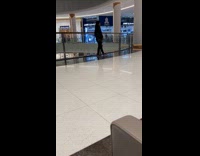 Woman tiktok dub video inside the mall