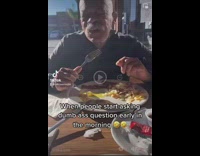 Older guy eating tells filmer to shut up when he asks question