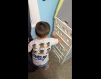 Kid shows secret stash behind toy cabinet
