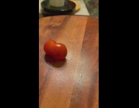 Small tomato grew and forms in a weird shape