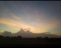 Sunset sky clouds look like a ship