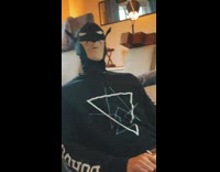 Guy wears Batman mask for karaoke 