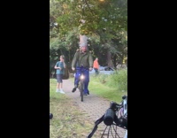 Man and woman rides bike fell down