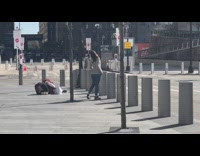 Woman Poses and Spins for Photographer on Ground