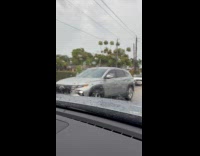 Two car crashes on the rainy street