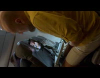 Woman records video with tripod in plane