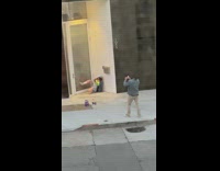 Green shirt girl poses apartment complex door 