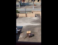 Man cleans roof with box on head