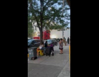 Truck stuck turning locals carries blocking car