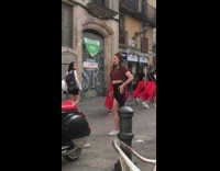 Woman in red stripes top dances at the street Part 2