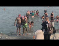 Two old guys full body tattoos beach 