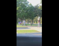 Girl hat grey skirt scooter street car